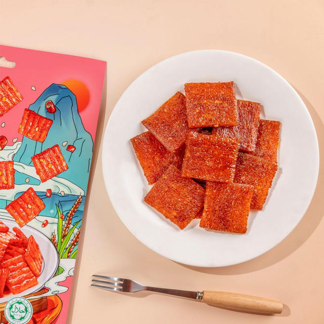 	Close-up of Traditional Sweet Spicy Chunk texture - thick chewy grain snack, Sweet Spicy flavor, vacuum-packed