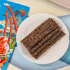 Close-up of Traditional Garlic Spicy Stick texture - chewy grain snack, Garlic Spicy flavor, vacuum-packed